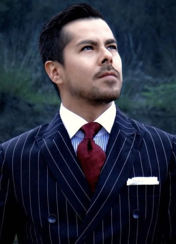 Ed Ruiz in pinstripe suit and standard lapel width